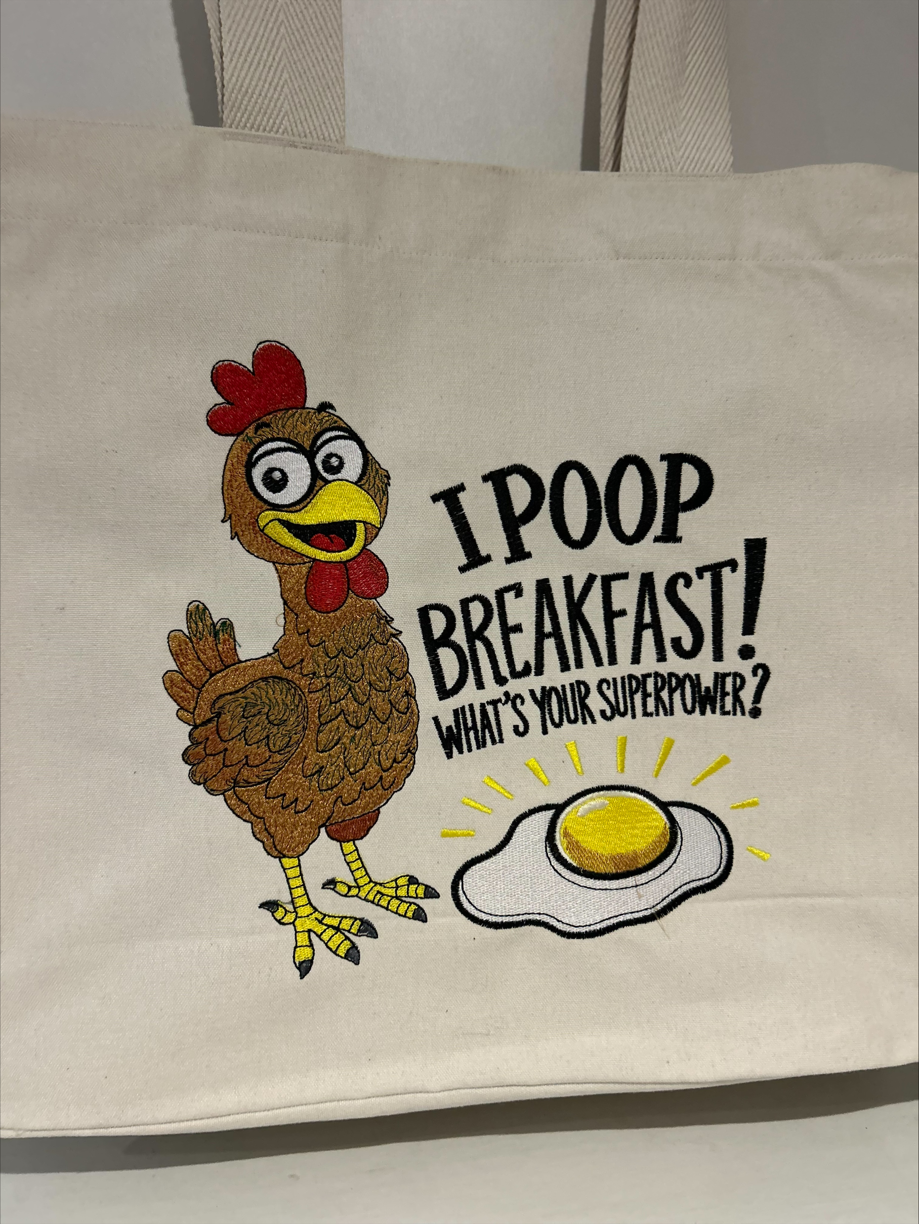 sac totebag avec une poule au super pouvoir de faire un oeuf pour le déjeuner